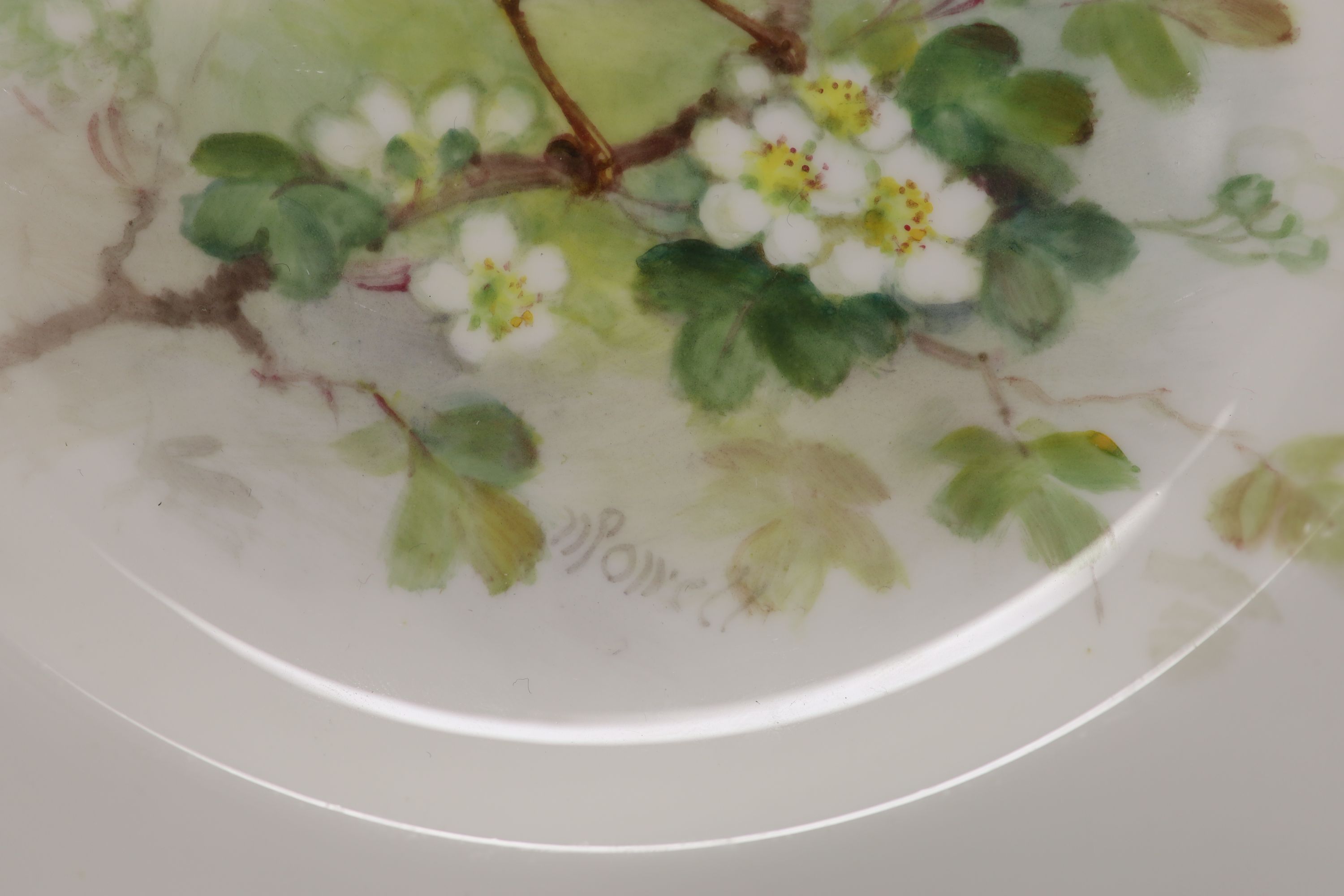 A Royal Worcester plate, painted with a blackbird on a blossoming branch by W. Powell, signed date mark 1939, diameter 23c,